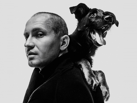 Studio portrait of Moscow wedding photographer Sasha Dzyubchuk (with his dog) of Russia Moscow wedding and elopement photography by Sasha Dzyubchuk of Russia
